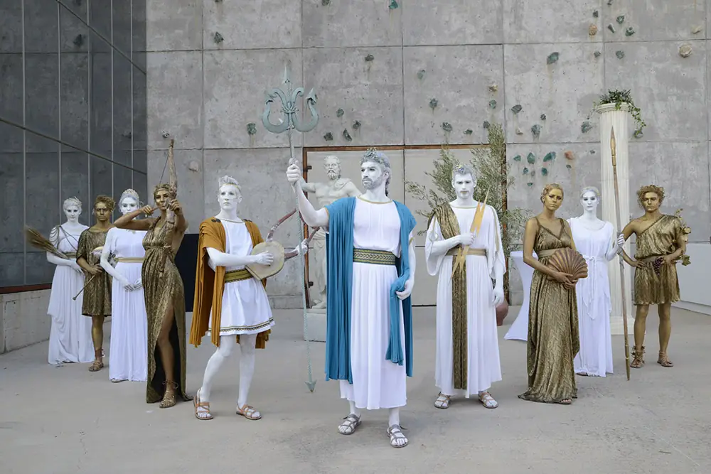 Performers dressed as ancient Greek gods at a One Event corporate evening